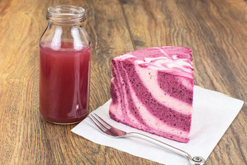 Obraz na płótnie Canvas Milk blueberry dessert and juice in bottle