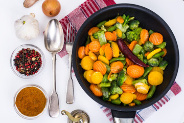 Frozen vegetables in frying pan for frying