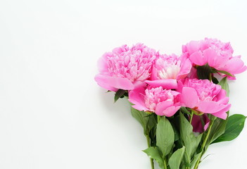 Beautiful bouquet of pink peonies on a white background. top view. copy space