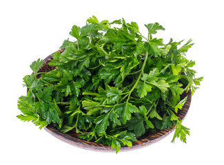 Obraz premium Fresh green parsley on wooden plate