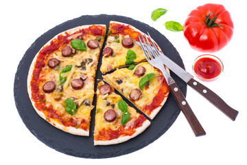 Homemade pizza on black stone plate