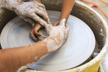 student learning how to use a pottery wheel  - 158770461