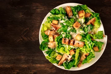  Chicken Caesar salad on rustic background with copyspace © laplateresca