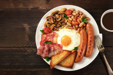 Overhead shot of English breakfast with coffee and copyspace