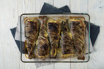 Cooked trout on a wooden background