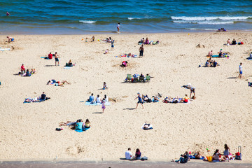Fototapeta na wymiar british seaside - summer holiday destination - top view of people on the beach in Bournemouth, Dorset, UK