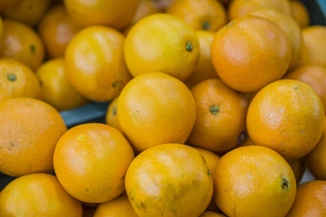 oranges fruit on market stall,with chinese new year background, in market,selective focus.