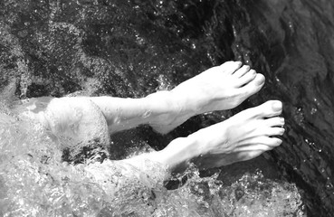 barefoot woman in the pool of the spa with balck and white effec