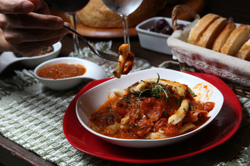 Italian dinner with breads, water and wine, table tidy