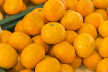 oranges fruit on market stall,with chinese new year background, in market,selective focus.