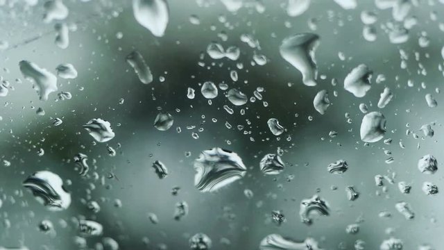 Rain falling on glass during rain storm. 3840x2160, 4k