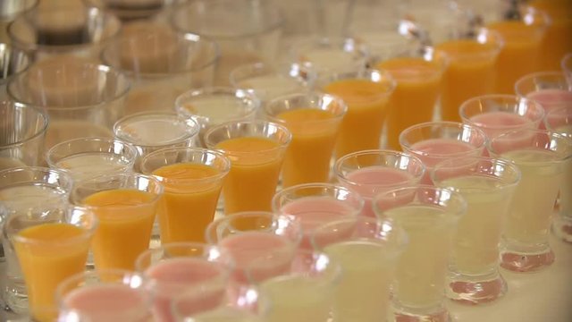 Glass shots with different kinds of juice