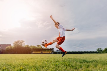 8 years old boy child playing football