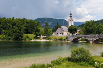 Beautiful church and bridge in Bohinj lake