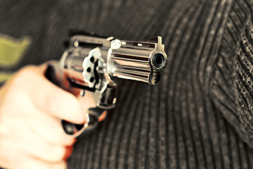 man with hand gun pistol rubber attack violence
