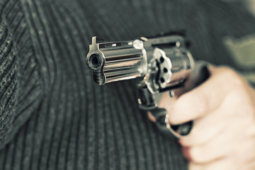 man with hand gun pistol rubber attack violence