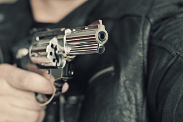 man with hand gun pistol rubber attack violence