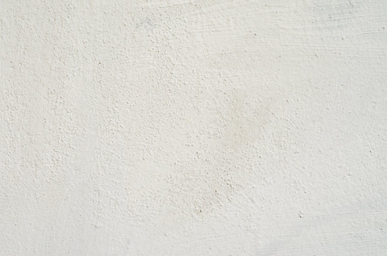 White plaster wall texture. Empty bright plaster background