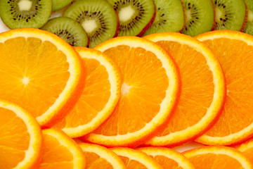 Fototapeta na wymiar cut orange heavily exposed, the background Kiwi