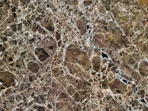 Brown marble stone seamless pattern background for both exterior and interior design on luxury wall or floor.