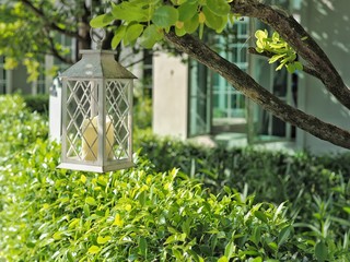 White vintage lantern decorate in the garden.