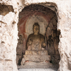 Fototapeta na wymiar Middle Binyang Cave with carved statues in Longmen