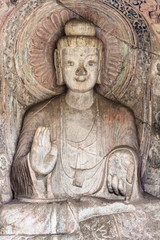 Fototapeta na wymiar Sakyamuni statue in Middle Binyang Cave