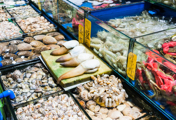 various mollusks in fish market in Guangzhou city - obrazy, fototapety, plakaty