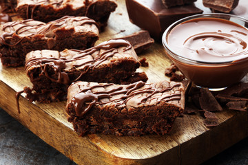 Brownie stack, chocolate cake on rustic wooden board