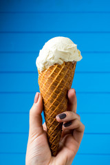 Vanilla ice cream with cone on white background