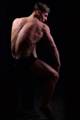 Fototapeta na wymiar muscular man with bare torso, six pack in underwear
