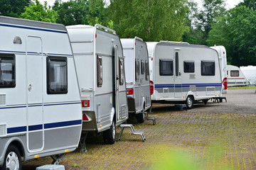 New touring caravans parked in a row on a travel trailer trade park