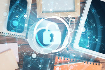 Business workplace with tablet pc and security concept on screen