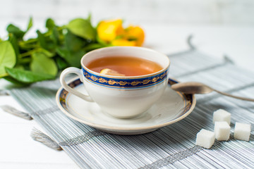 cups of tea with mint on wooden table