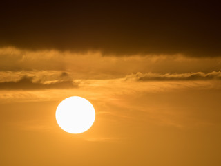 orange sky at sundown and dark clouds