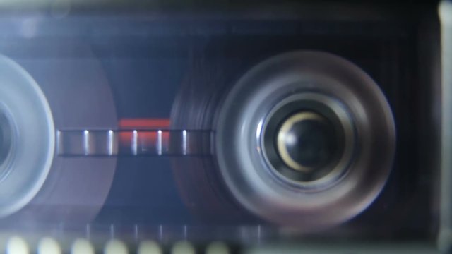 Closeup of turning tape in recorder