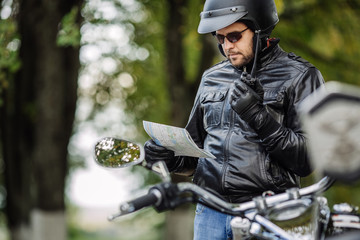 man with motorcycle. people, travel lifestyle concept