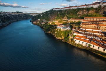 View of Douro river and the shore of Vila Nova de Gaia shot from Dom Luis I bridge, Porto, Portugal.