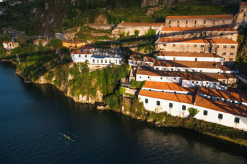 Fototapeta na wymiar View of Douro river and the shore of Vila Nova de Gaia shot from Dom Luis I bridge, Porto, Portugal.