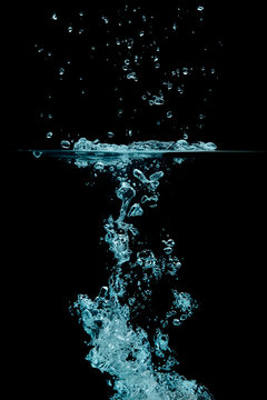 Splashing water with oxygen bubbles. Underwater background
