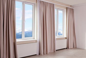 Landscape view through modern window in room