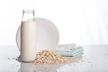 Obraz na płótnie Canvas Flakes and milk on a white background