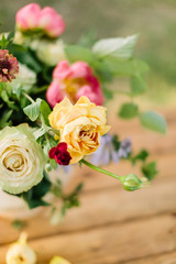wedding, gardening, floral design, decoration, celebration concept - in beautiful wedding bouquet creamy avalanches and bright yellow roses stand out from other flowers