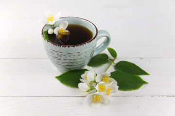 Black tea with jasmine on a white table