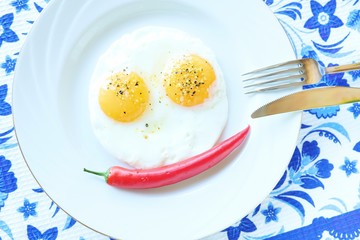 Funny eggs with red chile pepper 