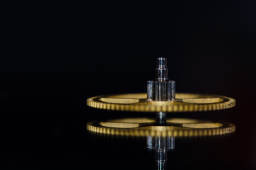 Naklejka premium Watch Parts: Vintage Metallic Watch Gear on Black Background