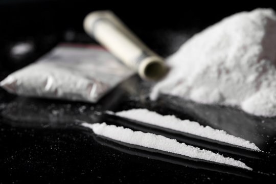 Cocaine on black background, closeup