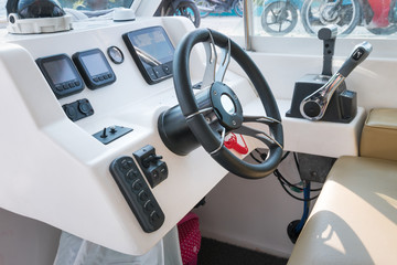 Control panel with wheel on speedboat