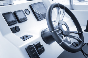 Control panel with wheel on speedboat © photopixel
