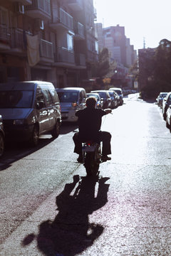 Biker riding on street